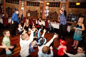 magician performing for children at party