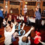 magician entertaining children at party